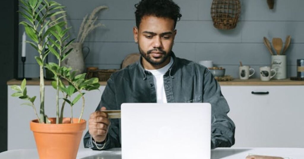 man researching upon live online plants on laptop