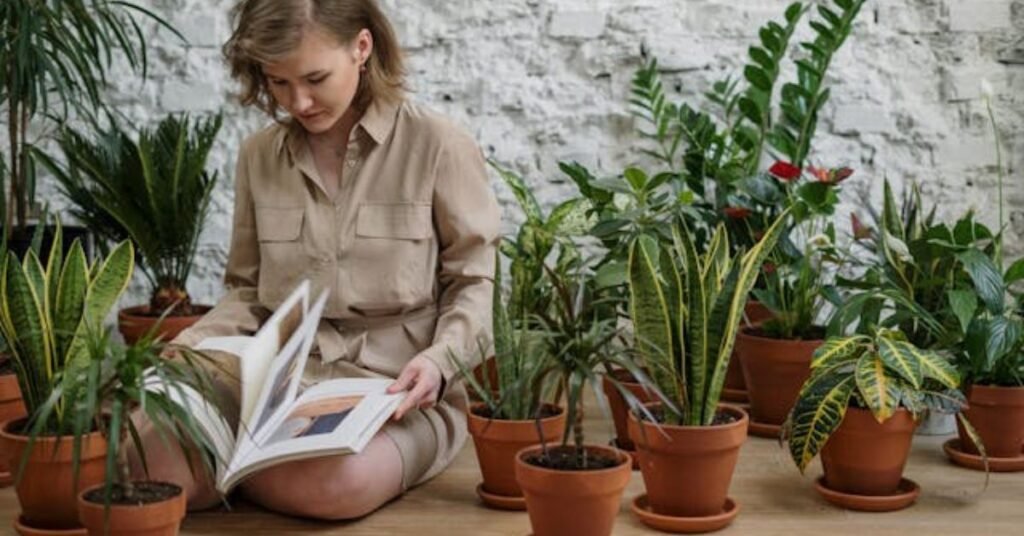 a girl relaxing between indoor plants